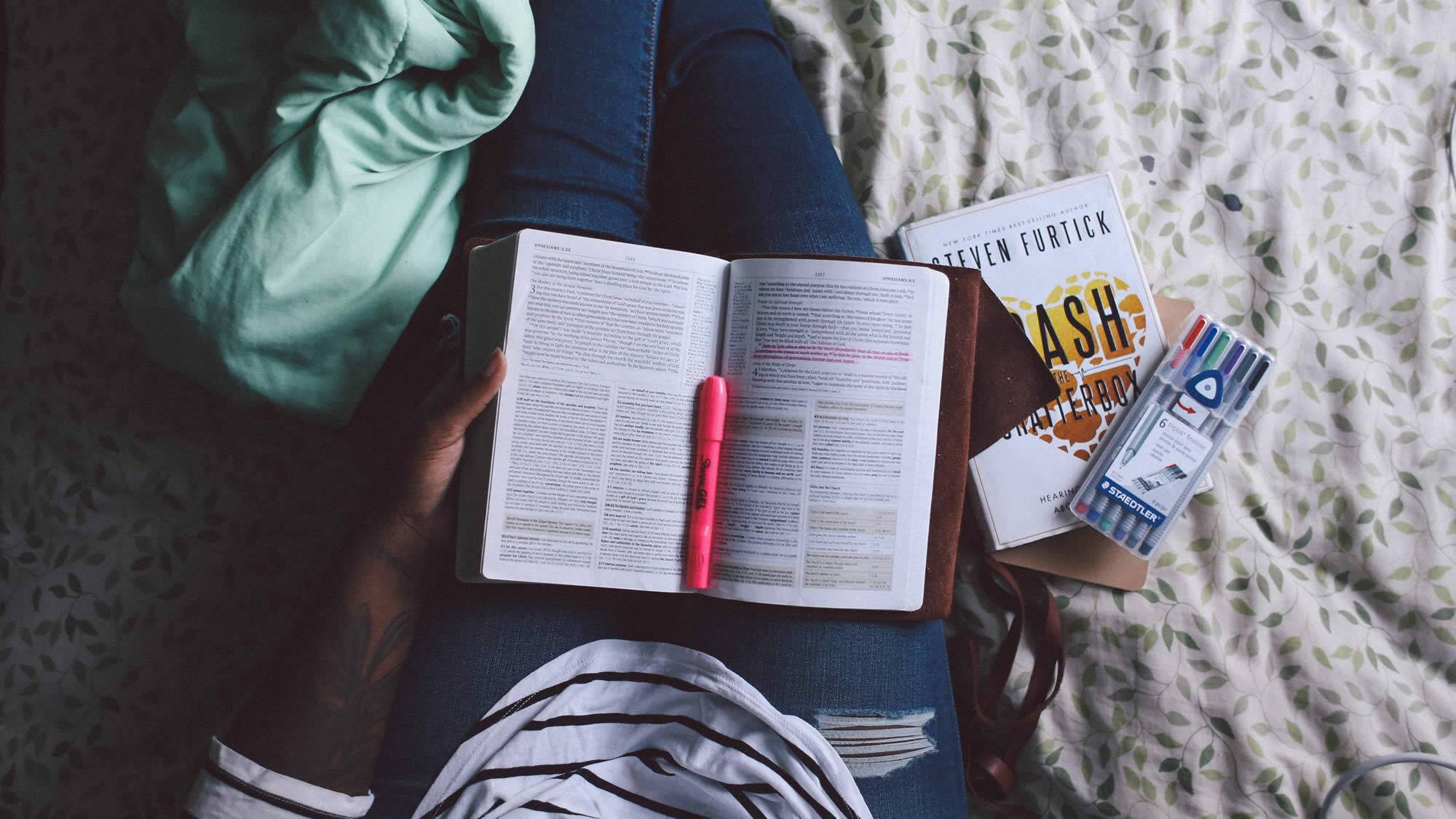 girl taking revision notes unsplash image